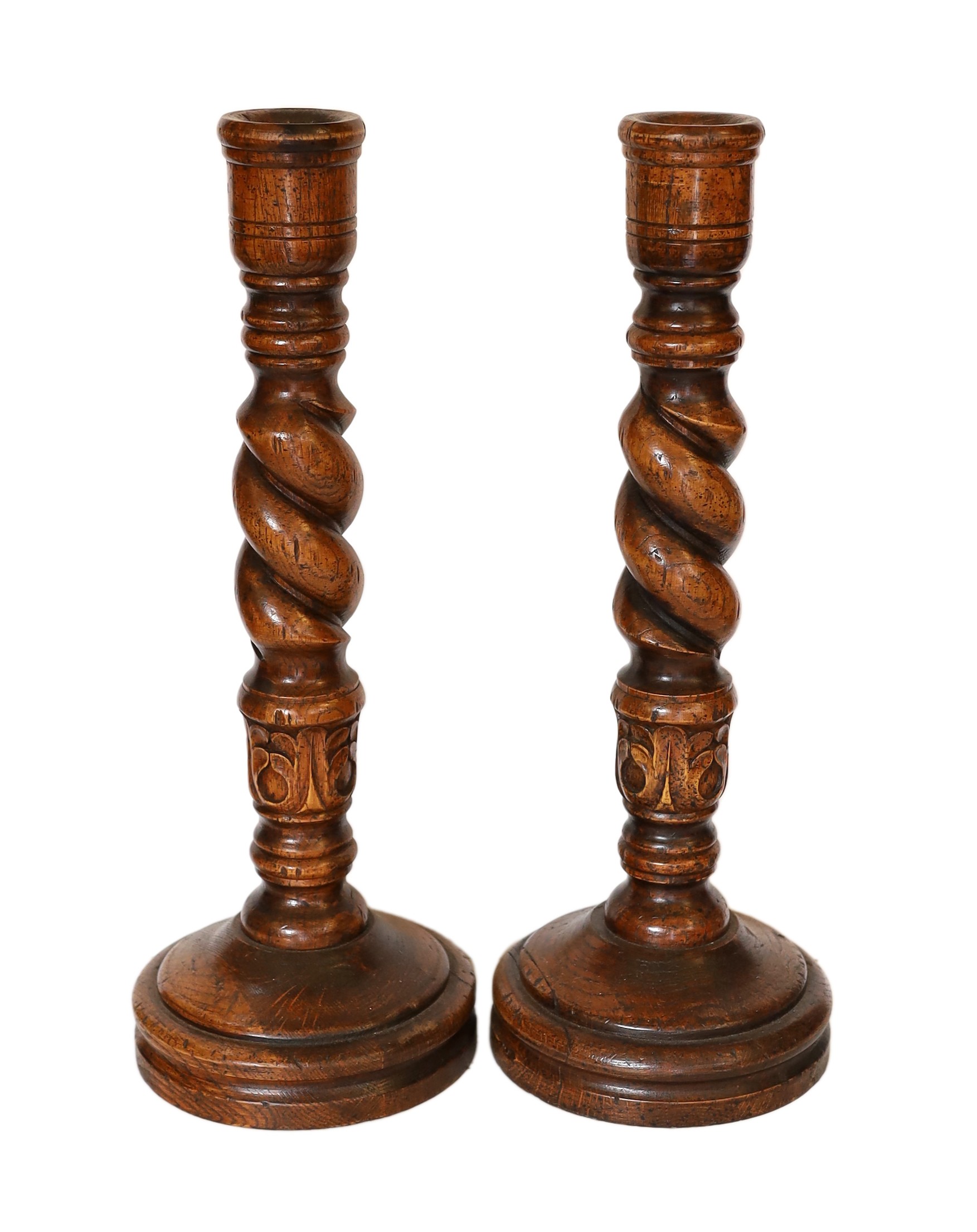 A pair of carved wood barley twist candlesticks, height 46cm